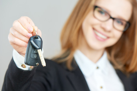 The business happy woman holding car keysの写真素材