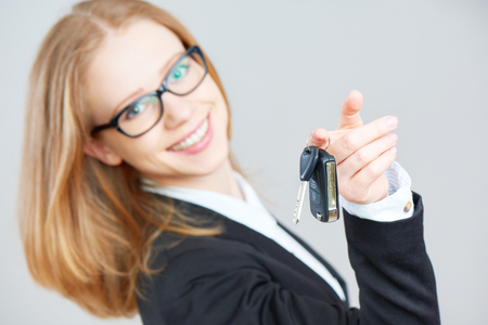 The business happy woman holding car keysの写真素材