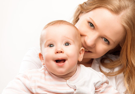 happy family mother and baby daughter hugging and enjoy life