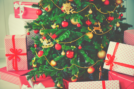 the Christmas tree and lots of giftsの写真素材