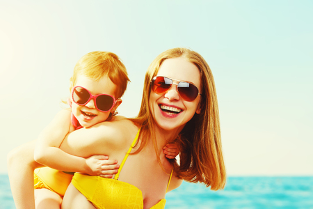 happy family on the beach. mother and child daughter  at seaの写真素材