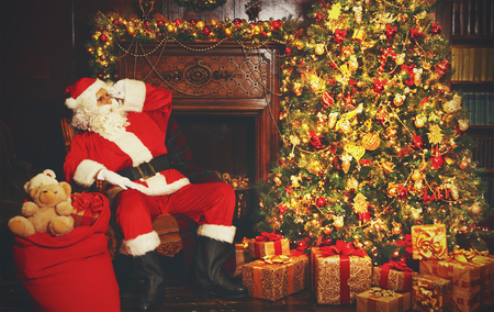 Portrait of Santa Claus around Christmas treeの写真素材