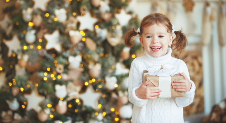 happy child girl with a Christmas presentの写真素材