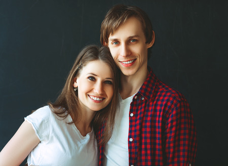 Happy married couple on a black backgroundの写真素材