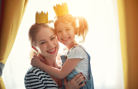 happy mother's day! mother and child daughter in crowns  
の写真素材