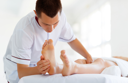 a beautiful girl enjoys massage and spa treatments
の写真素材