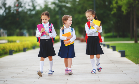 Happy children girls girlfriend schoolgirl student elementary schoolの写真素材