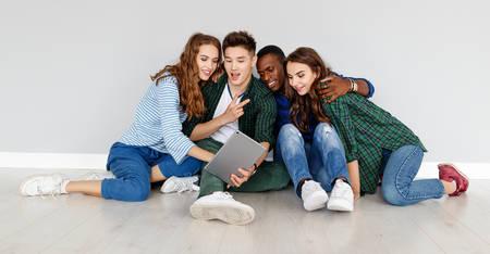 group of cheerful young people men and women multinational isolated on white backgroundの写真素材