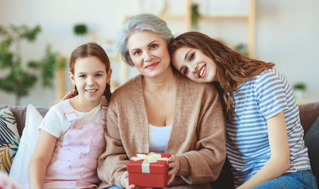Mother's day! Three generations of a loving family mother, grandmother and daughter congratulate on...