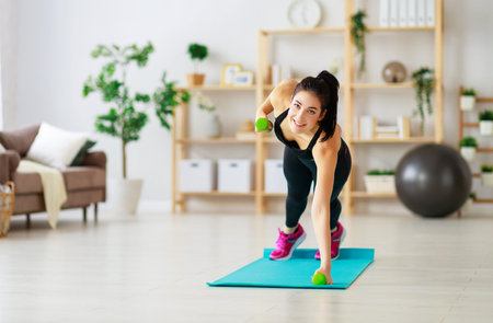 A young woman doing fitness and sports at home