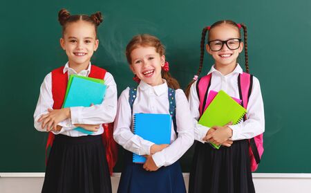 funny happy group children  student  girls about school blackboardの写真素材