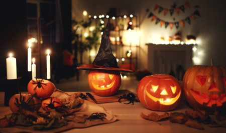 Dark interior of the house decorated for Halloween pumpkins, webs and spiders
