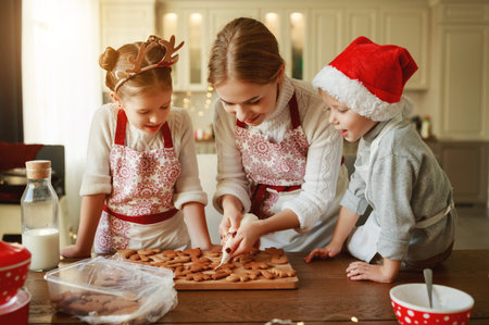 happy funny family mother and children  bake christmas cookies