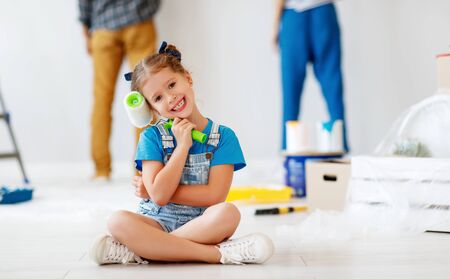 Happy family makes renovation in a new apartment.の写真素材