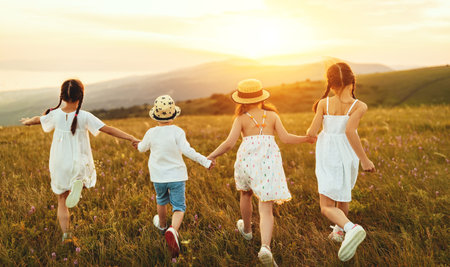 Unrecognizable cheerful little kids in casual white clothes having fun and running back in together...