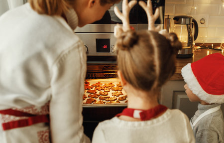 happy funny family mother and children bake christmas cookies