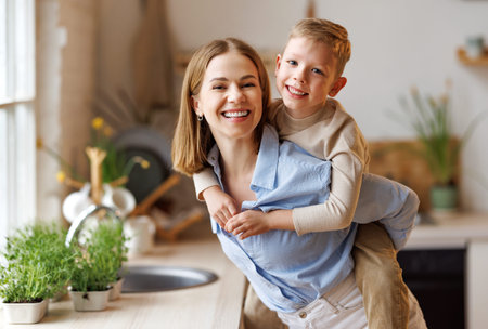 Mother playing with son in kitchen
