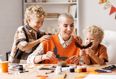 Young family mother and children preparing decorations for Halloweenの写真素材