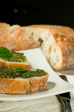 Organic ciabatta bread with pesto dressingの写真素材