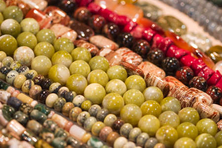 Lots of strings of beads made from natural stonesの写真素材