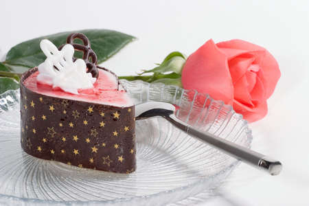Delicious raspberry souffle cake with pink rose for your valentine with copyspaceの写真素材