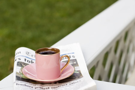 Cup of coffee and today's newspaper is a good start for a dayの写真素材