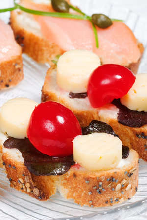 Closeup of smoked salmon with capers canape ready to eatの写真素材