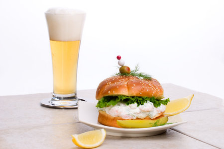 Rich-tasting, but low-calorie filling with shrimps delicious sandwich and glass of lager beerの写真素材