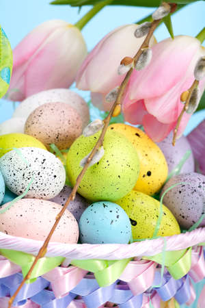Closeup of basket of easter eggs and pink tulipsの写真素材
