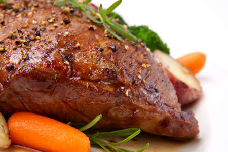 Roasted beef loin tri-tip, garnished with vegetablesの写真素材