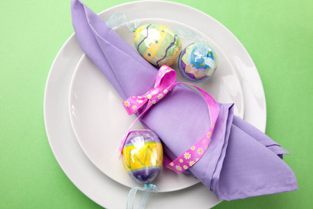 Closeup of Easter table setting with easter eggs