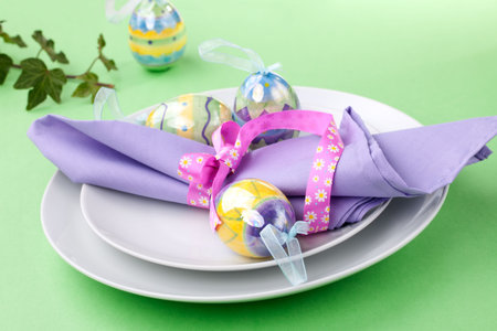 Closeup of Easter table setting with easter eggs