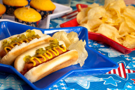 Hot dogs and cornbread on 4th of July in patriotic themeの写真素材