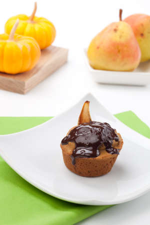 Just baked whole grain home made Pear Chocolate muffins and pears.の写真素材
