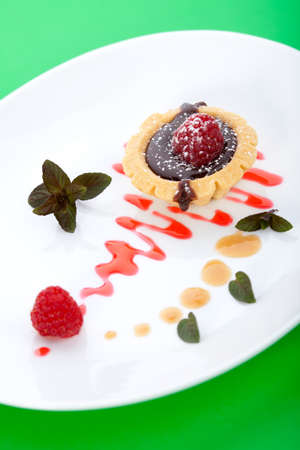 Closeup of delicious fresh raspberry chocolate petite cakeの写真素材