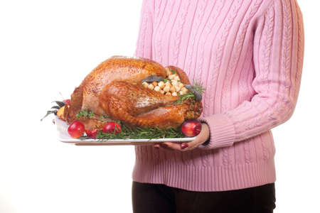Garnished roasted turkey on platter is ready to be servedの写真素材