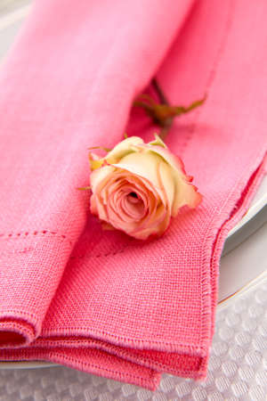 Romantic table settings. Arrangments with fresh roses and scented candlesの写真素材