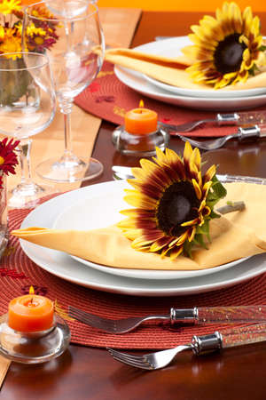Harvest festive dinner table setting with sunflowers.の写真素材
