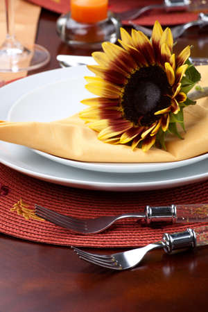 Harvest festive dinner table setting with sunflowers.の写真素材