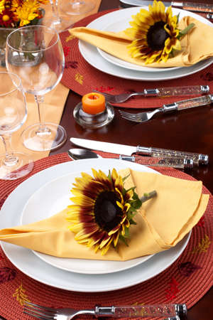 Harvest festive dinner table setting with sunflowers.の写真素材