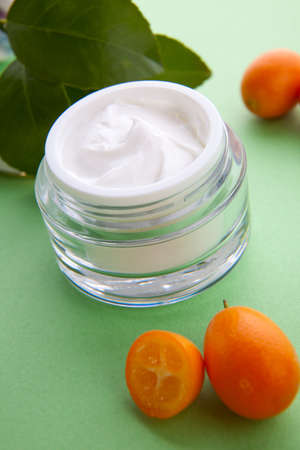 Closeup of jar of moisturizing face cream and fresh citrusの写真素材
