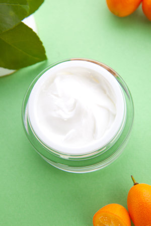 Closeup of jar of moisturizing face cream and fresh citrusの写真素材