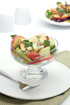 Closeup of blue cheese - pecan apple salad with apples, blue cheese, parsly and pecan nuts served for healthy lunchの写真素材