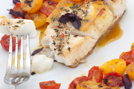 Pan fried halibut garnished with fennel seeds and spicy mustard sauce, served with fried cherry...