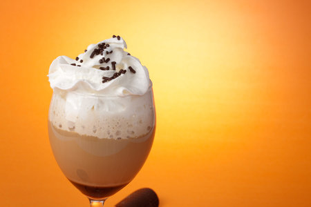 Close up of glass of fresh, delicious Chocolate Vanilla Coffee Cocktail, and Dark Chocolate Crisps