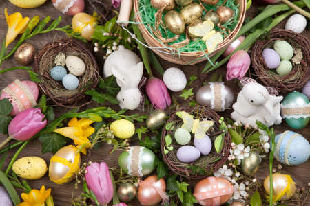 Close up of Easter assortiment of Easter eggs, spring flowers, and toys.の写真素材