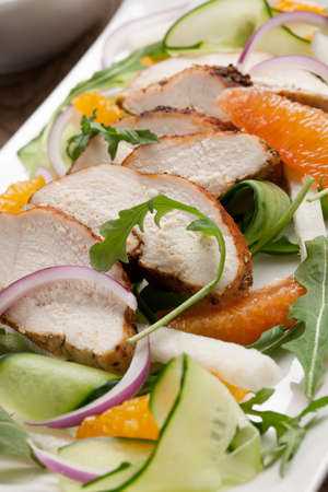 Southwest salad with sliced spicedrubbed roasted turkey tenderloins with creamy avocado dressing.の写真素材