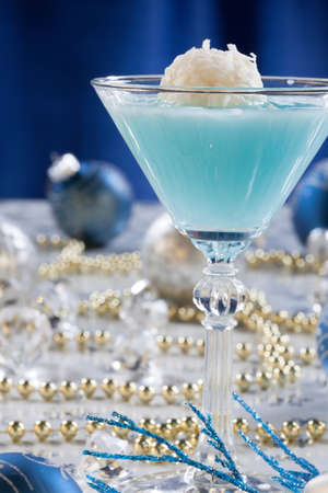 Glasses of Mint Manhattan cocktails surrounded with Christmas ornaments and decorations. Holiday cocktails series.の写真素材