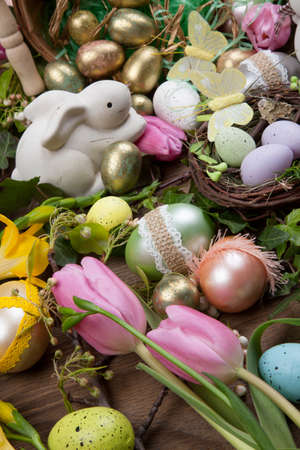 Close up of Easter assortiment of Easter eggs, spring flowers, and toys.の写真素材