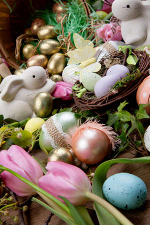 Close up of Easter assortiment of Easter eggs, spring flowers, and toys.の写真素材